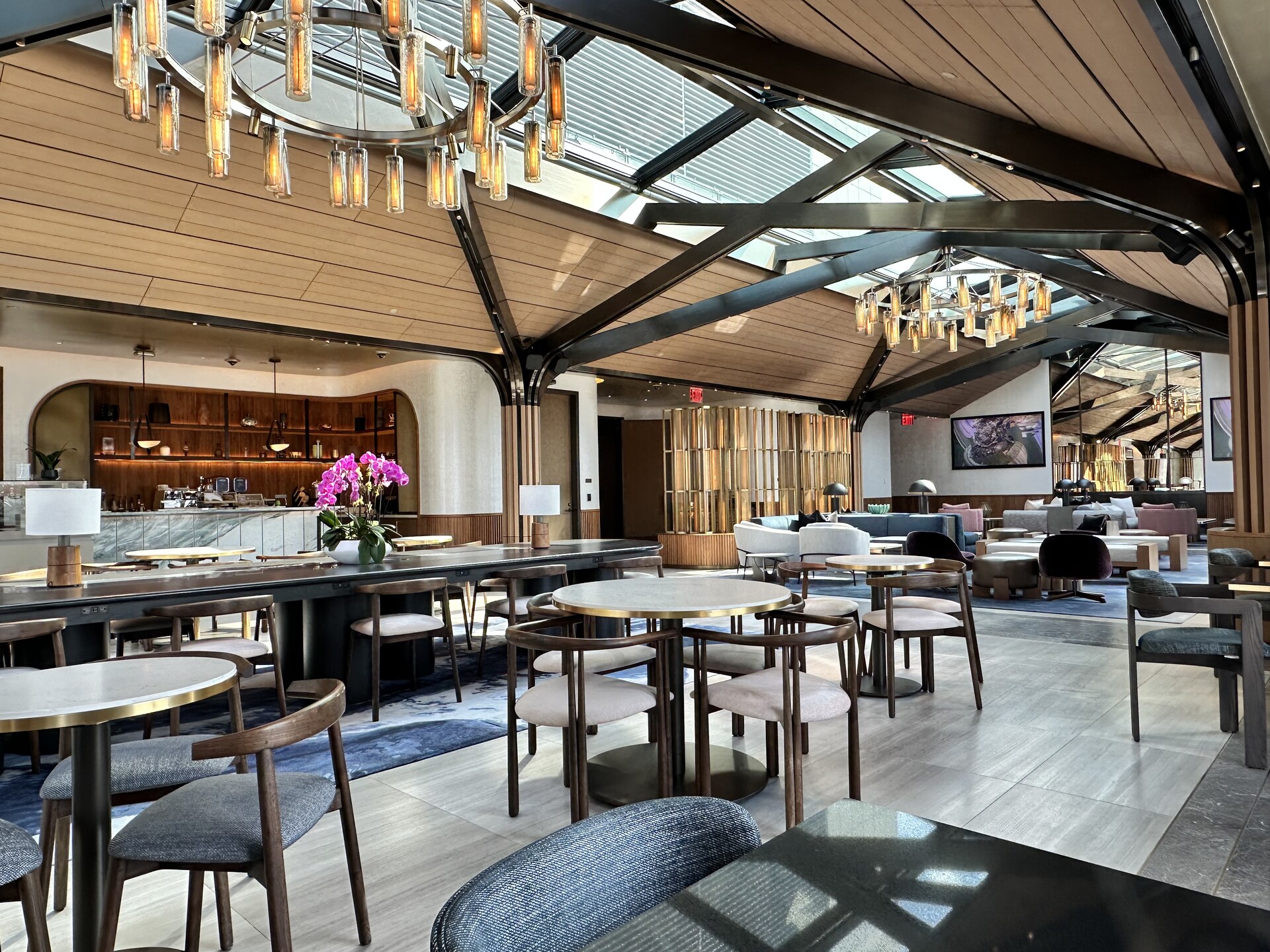 One Madison Avenue — residential dining room with warm wood floors and tall windows
